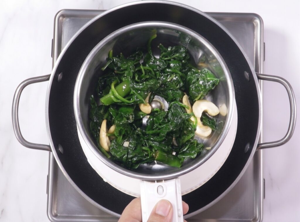 Spinach and cashews prepared for palak paneer ingredients list