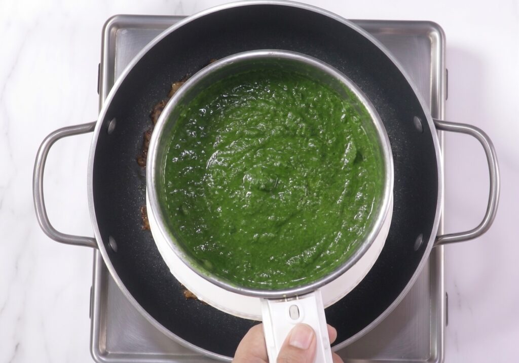 Smooth spinach puree prepared for homemade palak paneer recipe